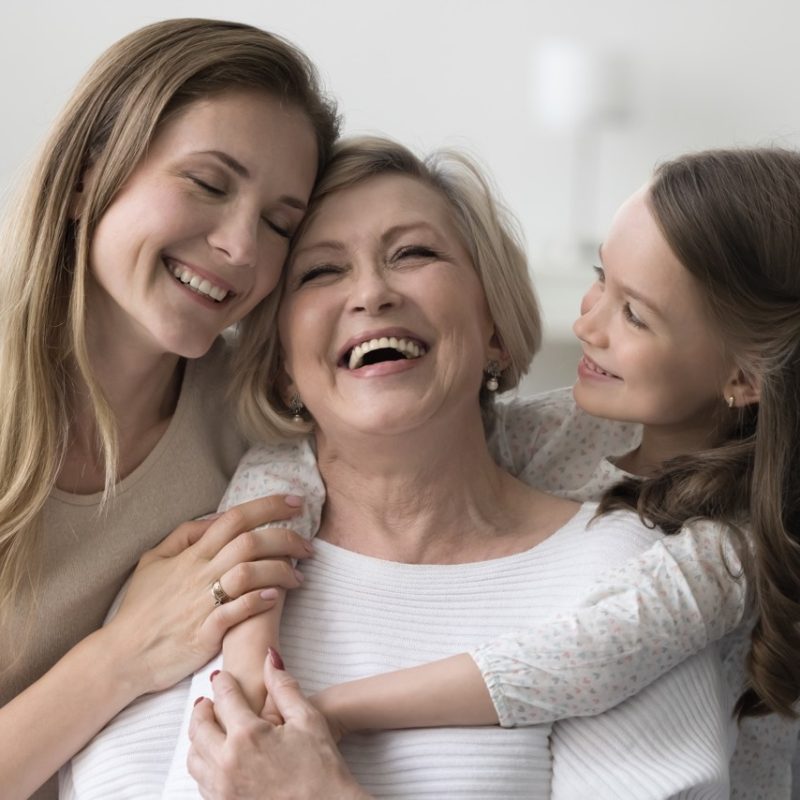 Joyful,Grandkid,Girl,And,Adult,Daughter,Woman,Hugging,Happy,Excited Joyful grandkid girl and adult daughter woman hugging happy excited grandma, celebrating birthday, mothers day, smiling, laughing, having fun, enjoying family meeting, warm relationships